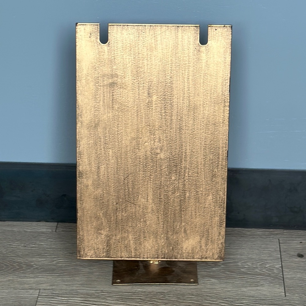 Metal necklace holder.